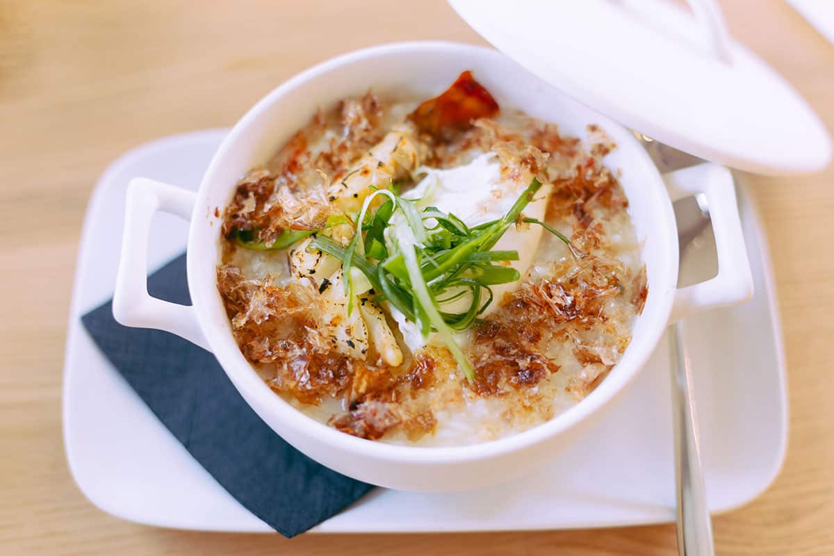 Lobster meat is slowcooked in rice congee for a luxurious spin on the Chinese breafast classic.