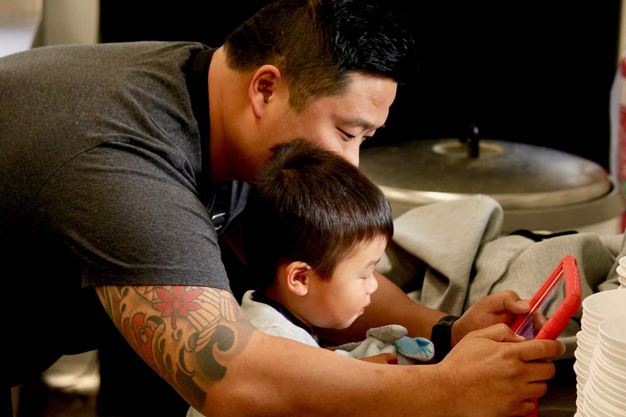 Malcolm Chow and his son