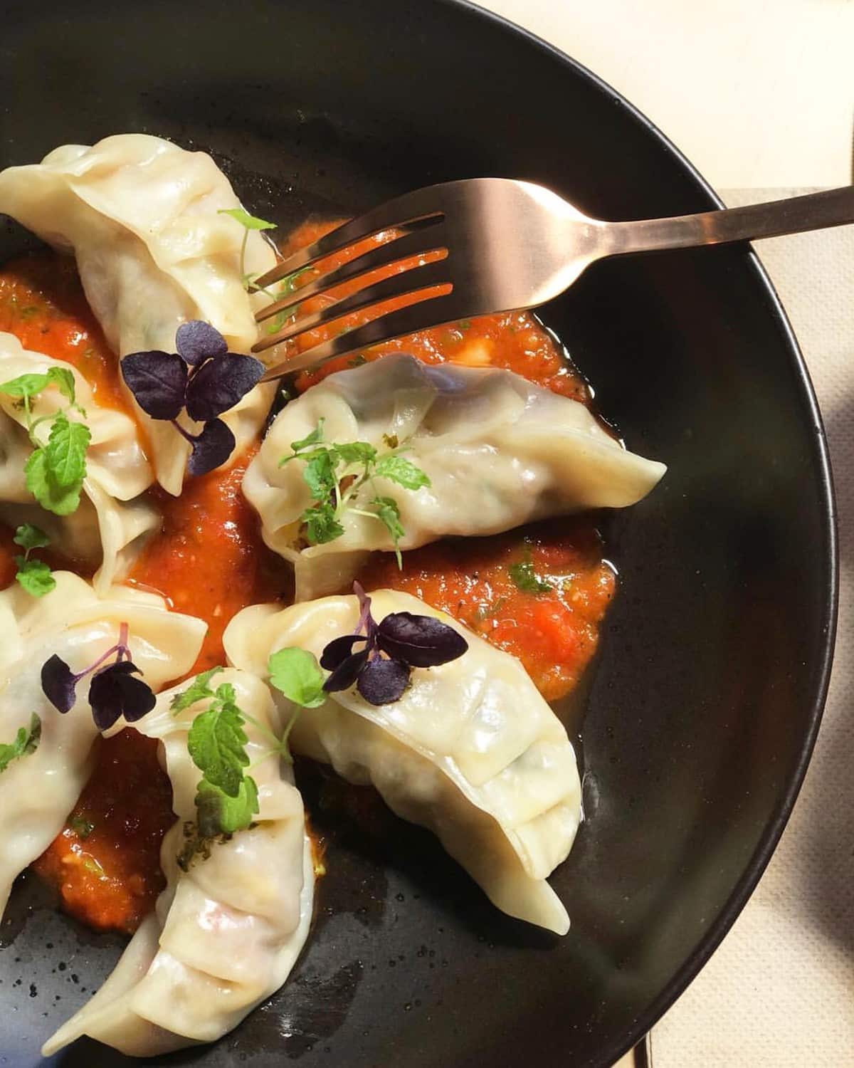 Himalayan momos (dumplings) come in three flavours, including a breakfast-style bacon and eggs version.
