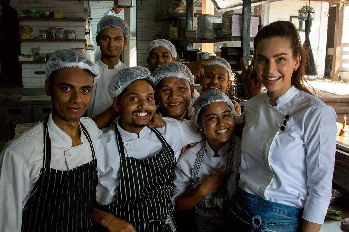 Sarah Todd with staff at Antares restaurant in Goa