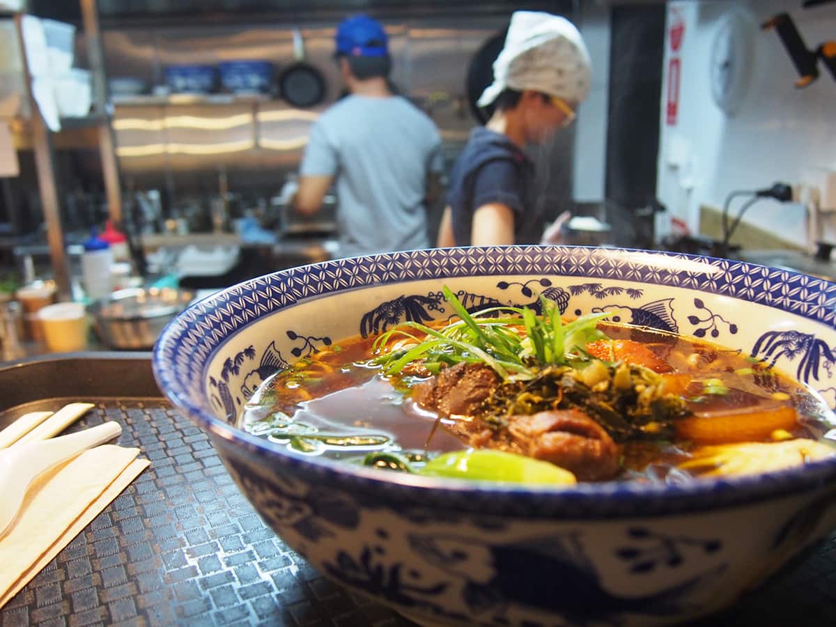 Beef is braised for eight hours in a rich broth for Hungry Paulie's famous handmade noodle bowls.