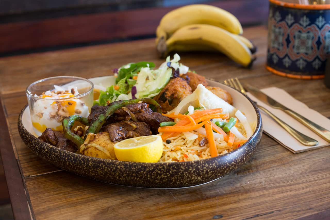 New Somali Kitchen: The combo platter gives you a bit of everything: rice, slow-cooked lamb, sambusa, vegetables, bajeya, chilli sauce and a dessert.