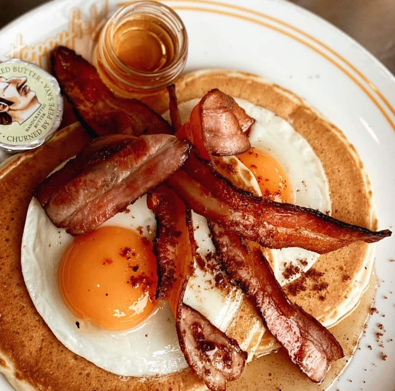 Pancakes with bacon and eggs