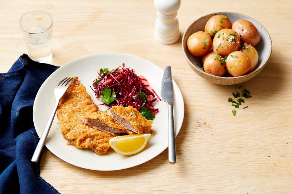 Walnut and parmesan crumbed schnitzel with red coleslaw