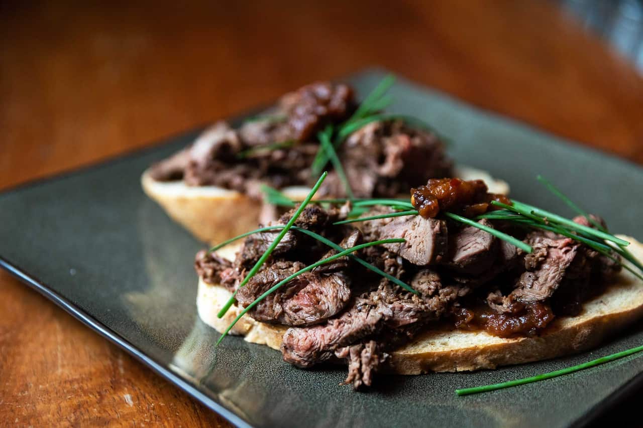 Parrtjima showcased native ingredients, such as seared kangaroo fillet with bush tomato relish and wattleseed spiced damper.