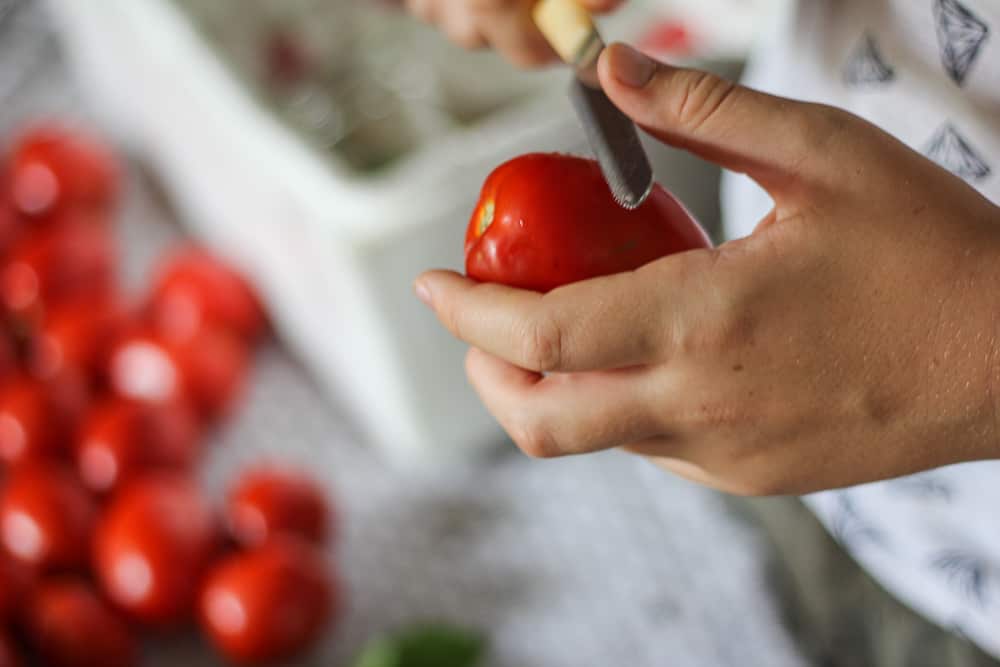 Preparing the tomatoes for passata.