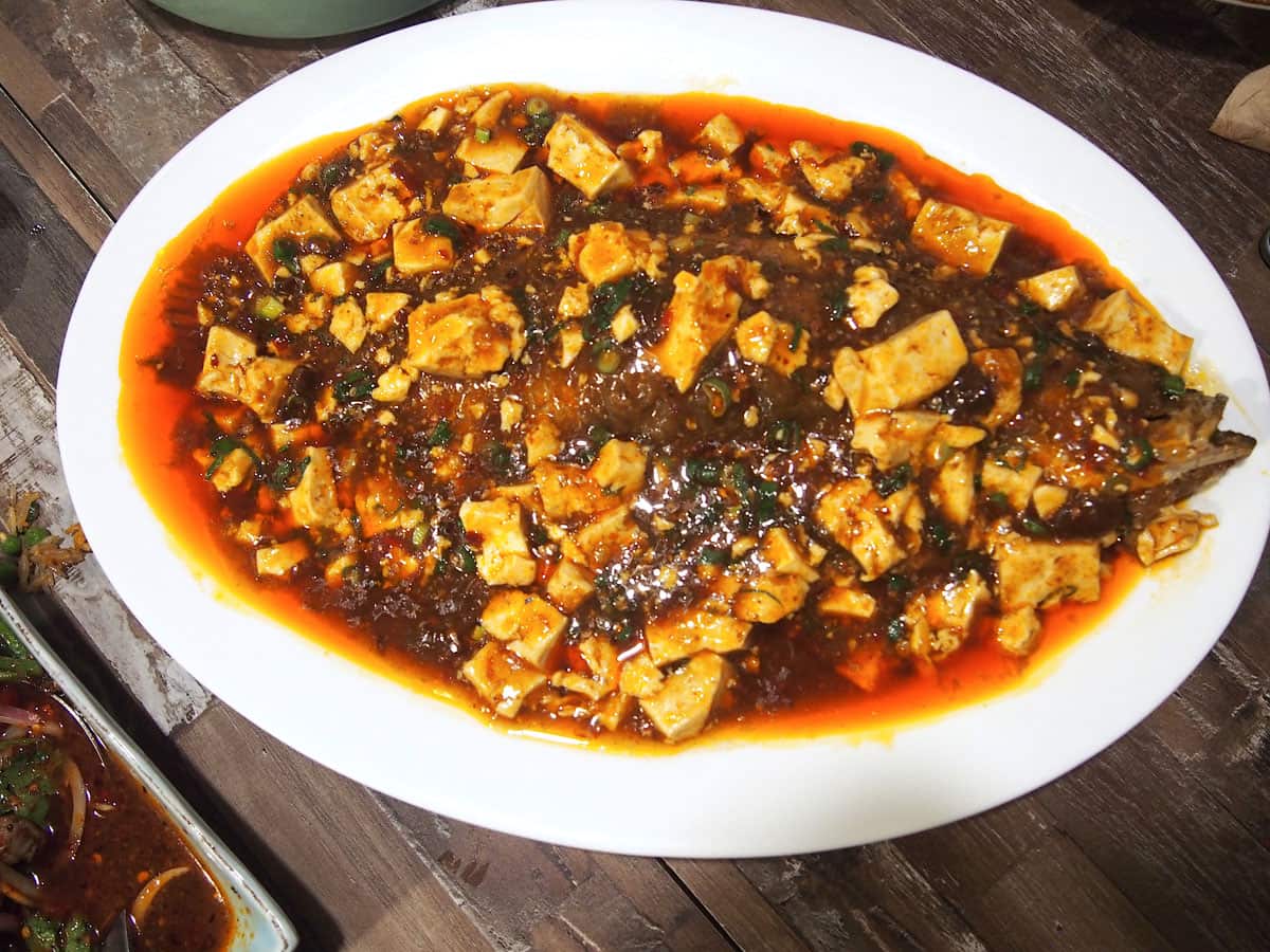 Braised whole fish with Mapo tofu is a Yunnan speciality.