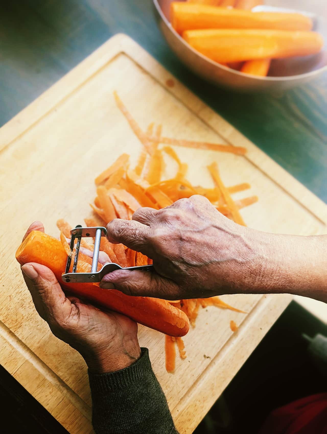 Peeling carrots.