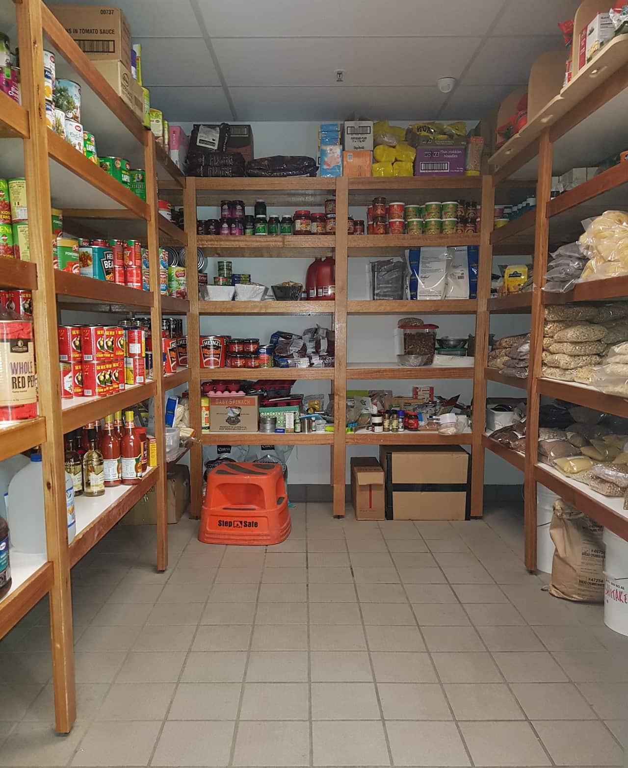 Antarctica: The non-perishables pantry: Donna and helpers replenish this weekly from stocks in the main Green Store