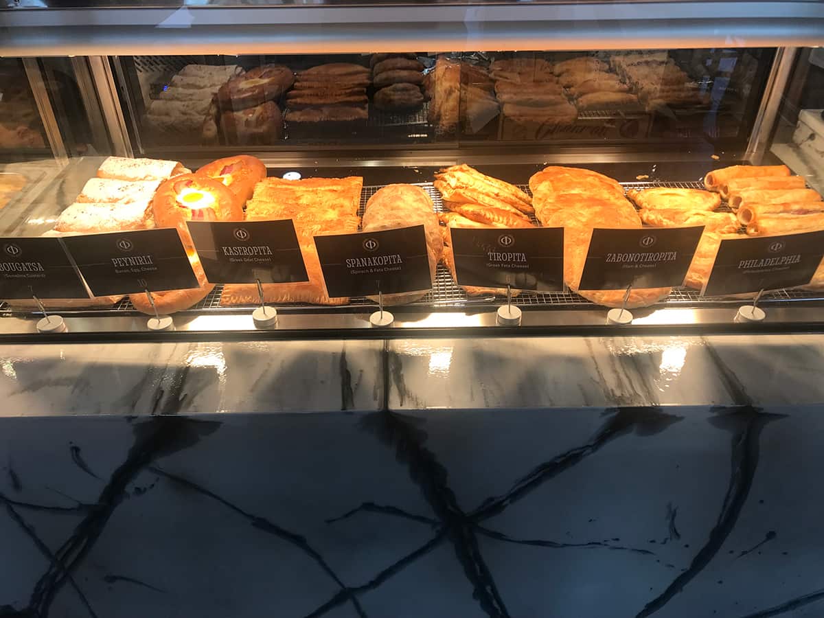 A rotating oven of hot pies inclused the famous Thessaloniki bougatsa.