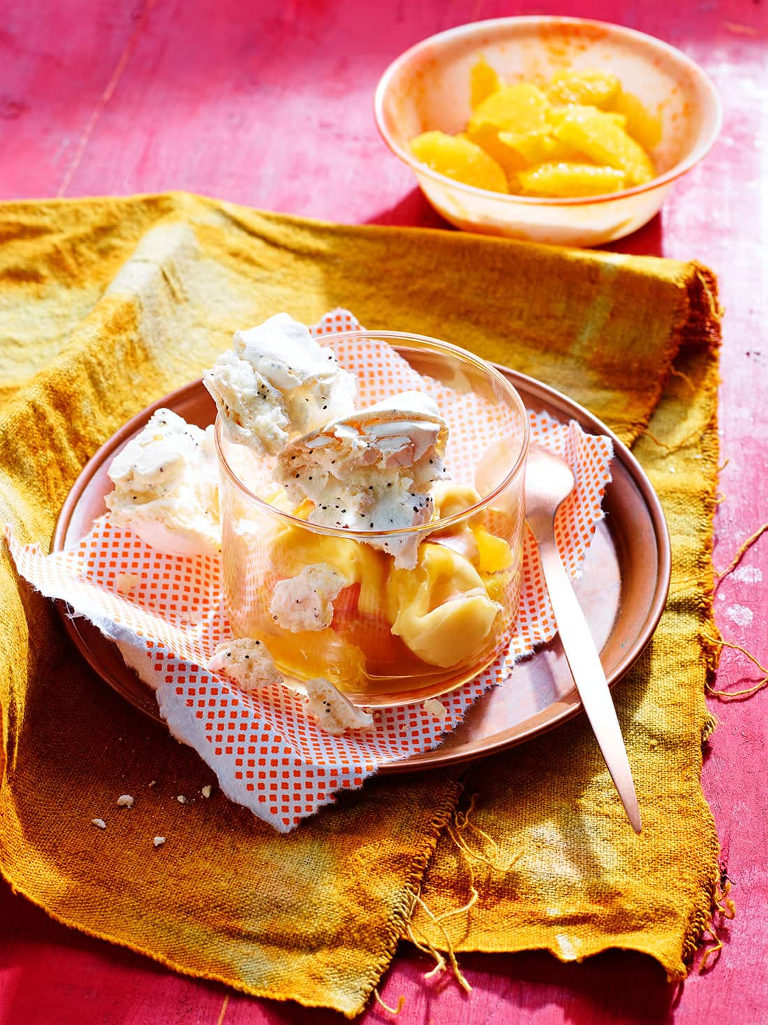Poppy seed meringue with orange cream and caramel oranges 