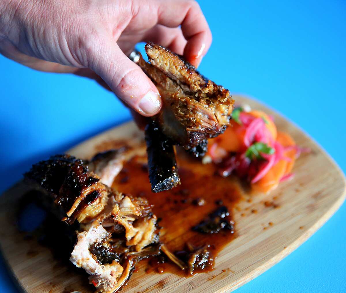 Pork ribs come with bajan, a commonly used pepper sauce in Barbados.