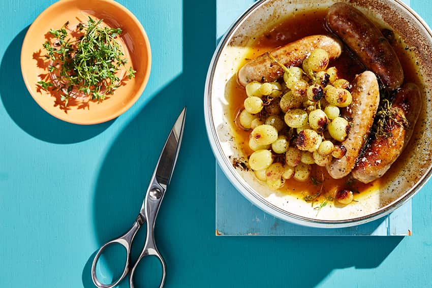 Pork sausages roasted with grapes and verjuice