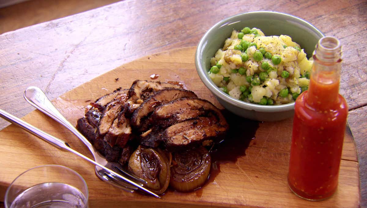 Jerk pork belly with pea and potato mash-up 