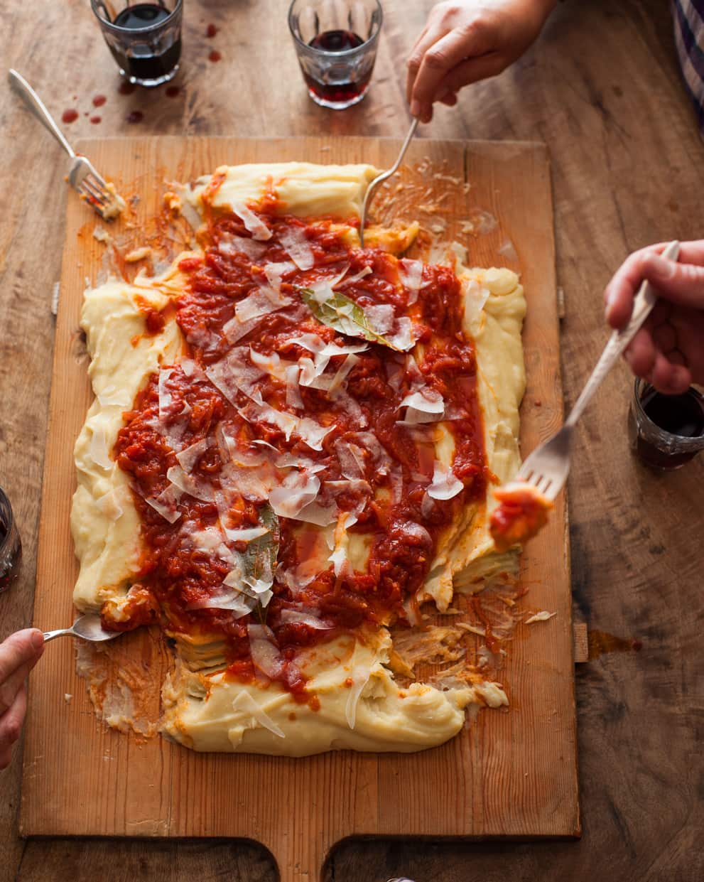 Potato polenta with onion, cheese and tomato