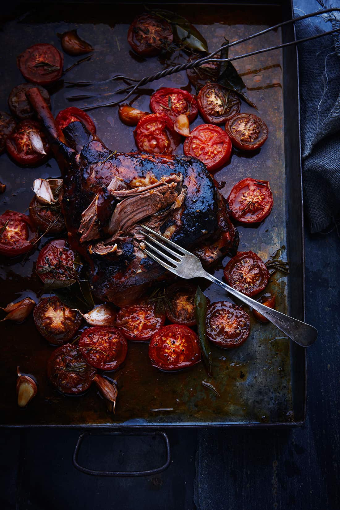 Slow-roast leg of lamb with tomato and garlic crust