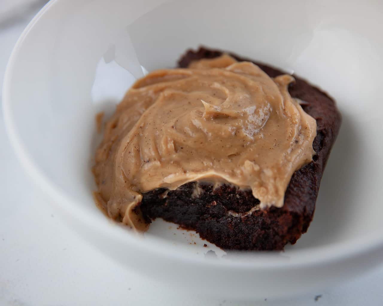 Gluten-free pumpkin brownie pudding with peanut butter sauce