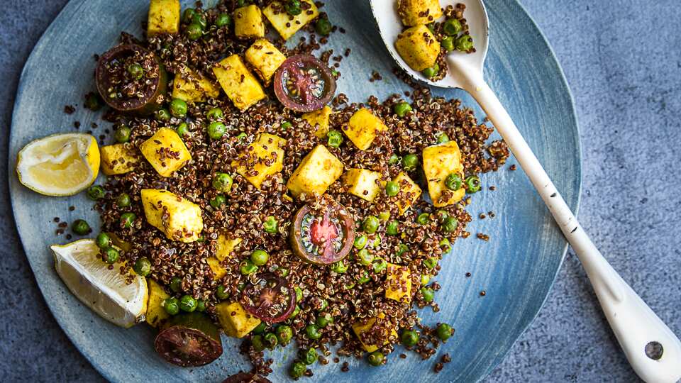 Curried red quinoa, pea and paneer salad
