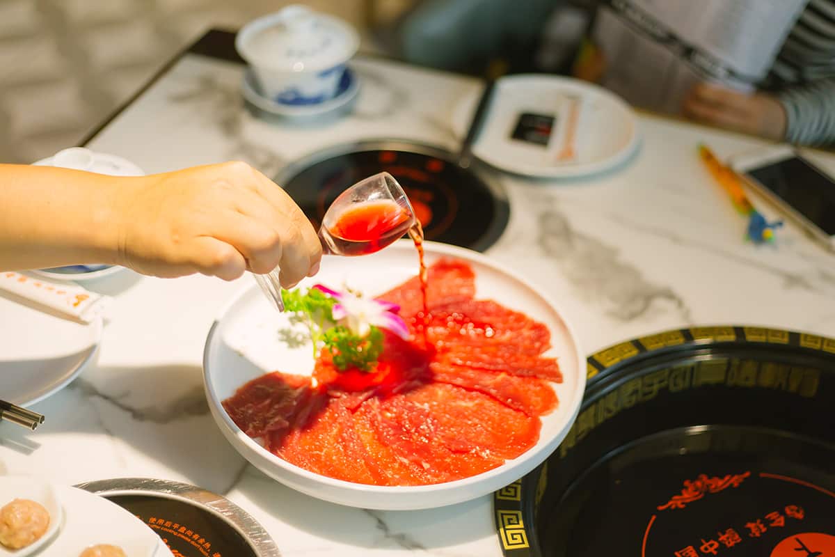 Red wine beef is one popular hotpot option with sides  and sauces - optional.