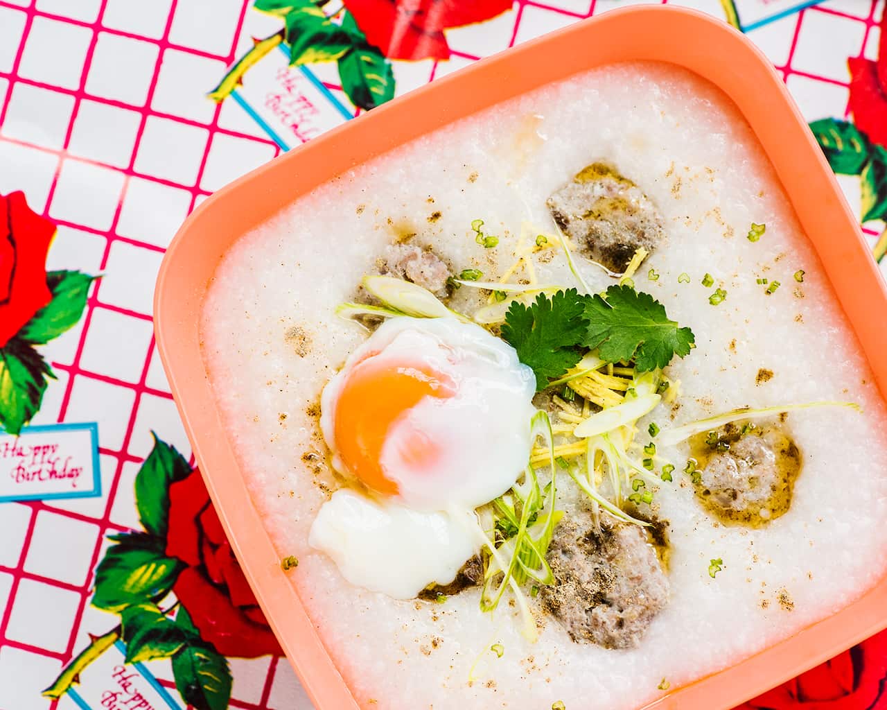 Rice porridge with pork meatballs and soft-boiled egg (jok)