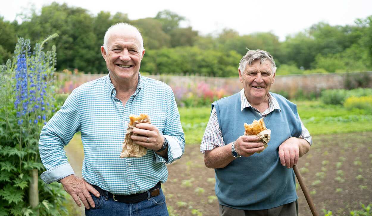 Rick Stein with head gardener John Harris in Tresillian House garden with pasties