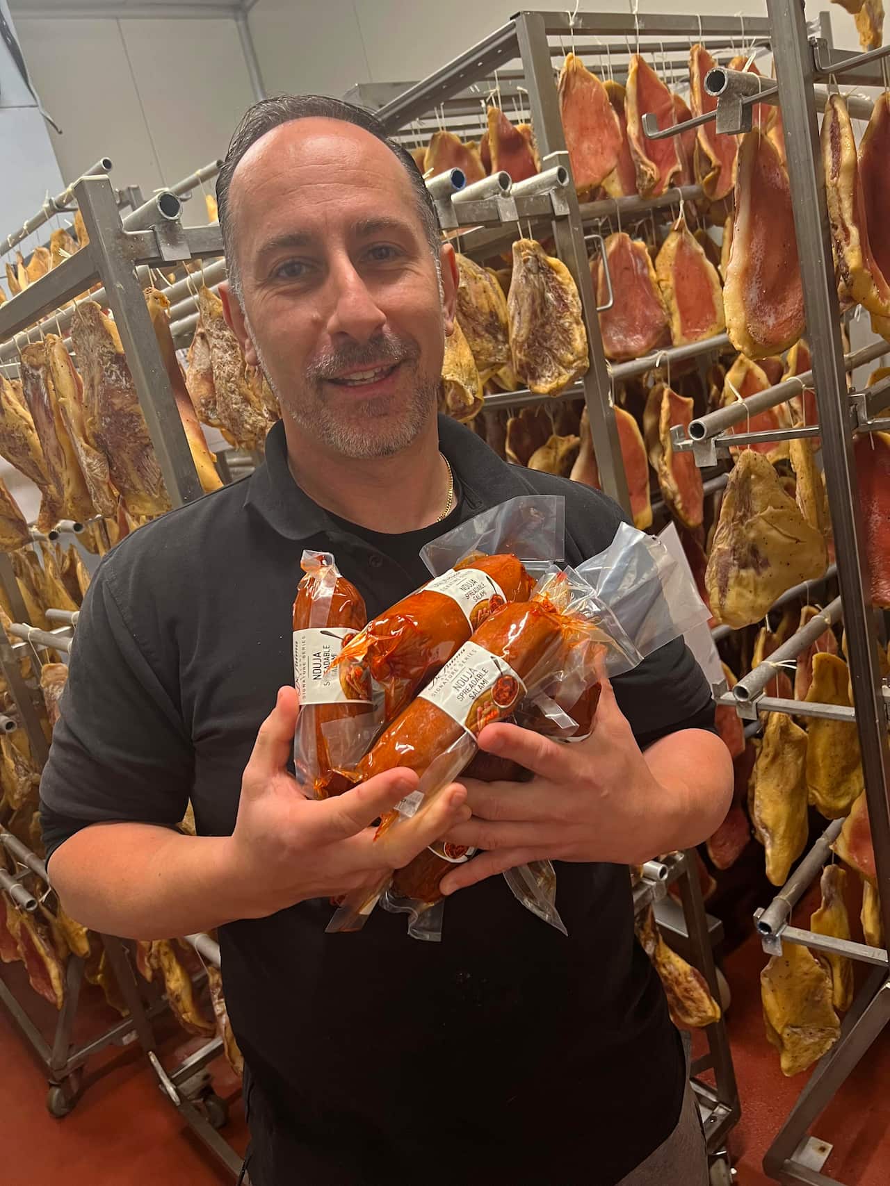 Rob De Palma in amongst the 'nduja at De Palma Salumi