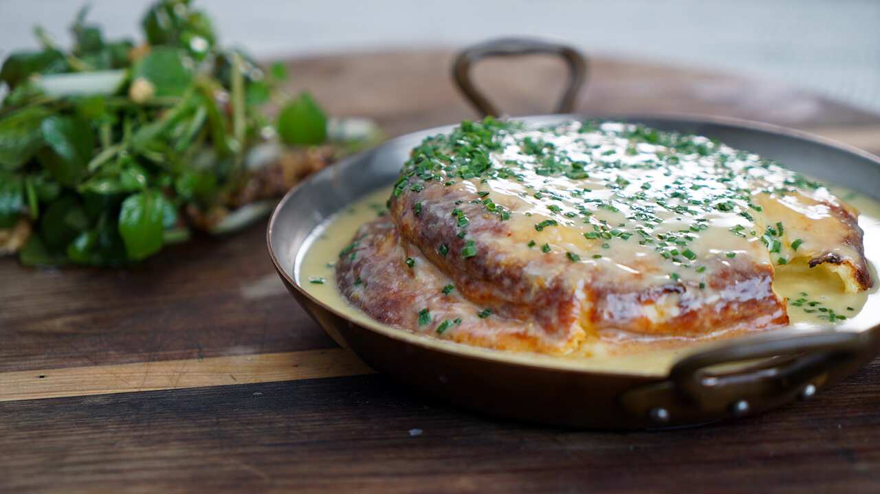 Cheese soufflé with Roquefort cream, watercress salad
