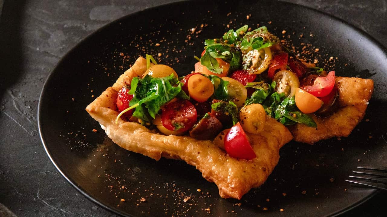 Johnny cake bruschetta with rocket and bush tomatoes 