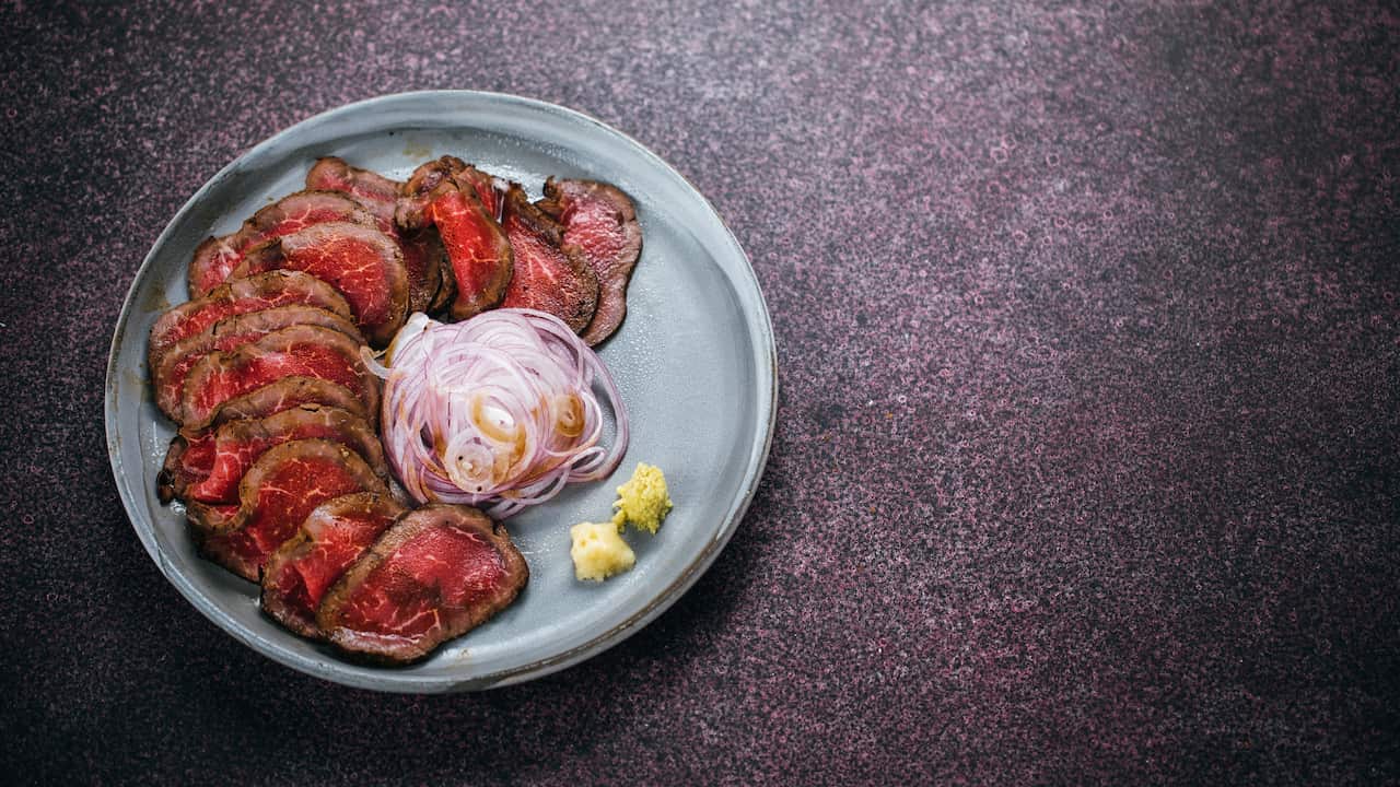 Beef tataki with shaved onion and ponzu