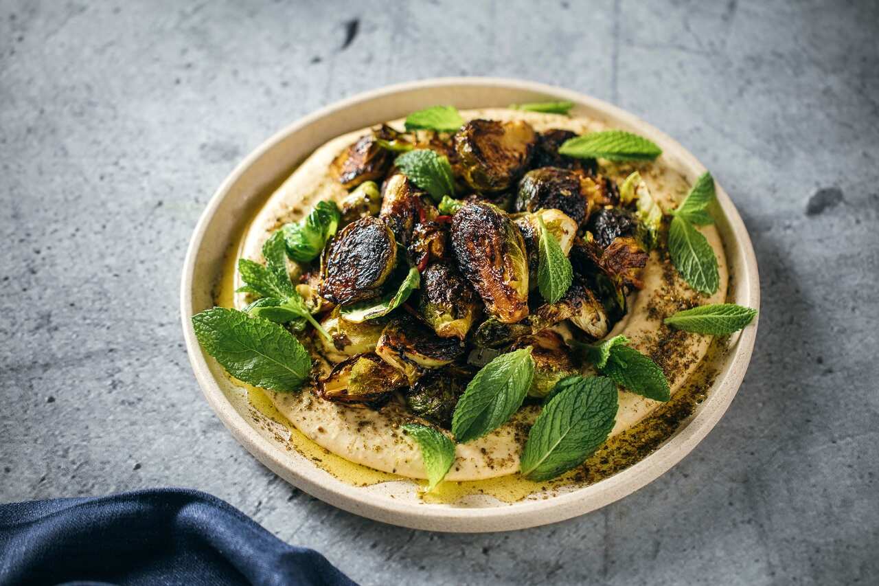 Crispy Brussels sprouts, hummus, chilli and mint