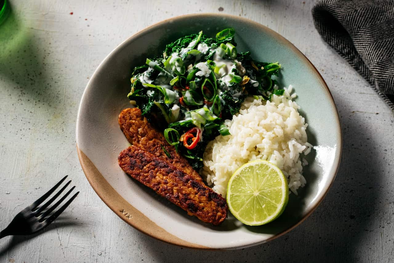 Tempeh with chilli, garlic wilted greens and coconut milk 