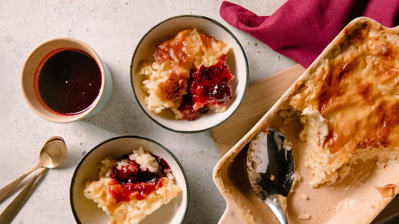 Baked rice pudding with plum jam