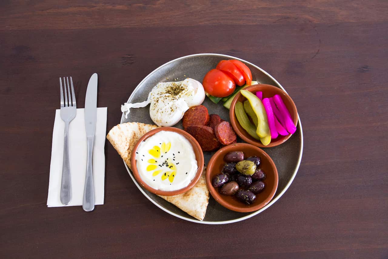 Even the breakfast features pickles, Lebanese bread and hummus.