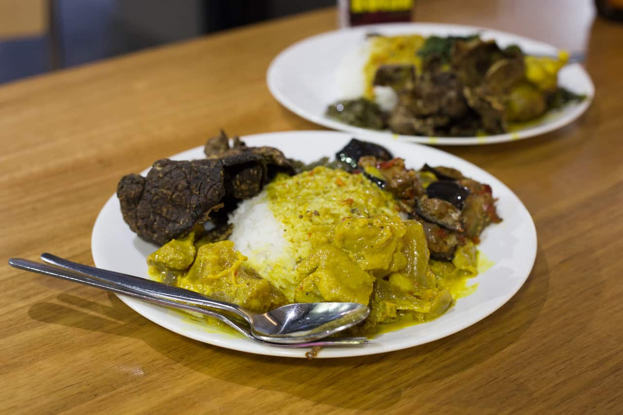 Three dishes and rice from the bain-marie menu: tendon, spicy eggplant and crispy beef.