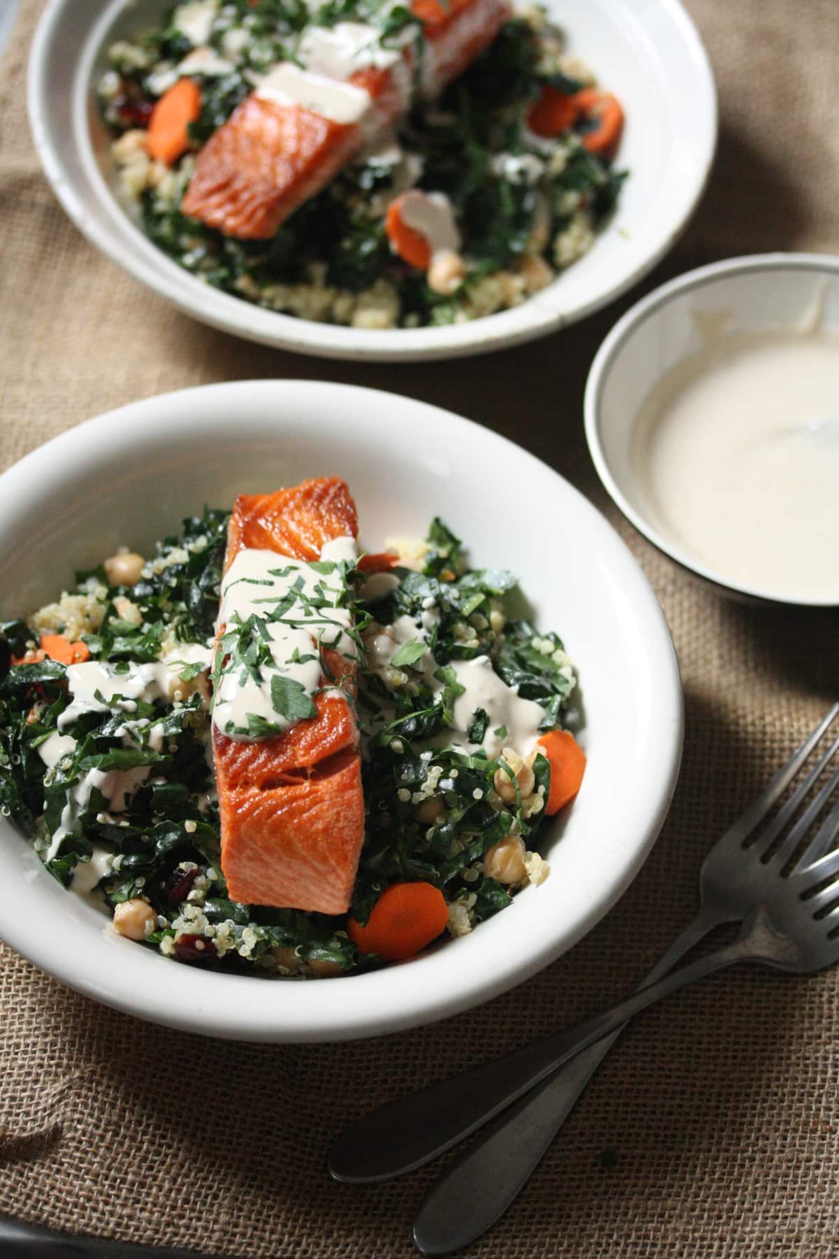 Salmon, kale and quinoa bowls with tahini sauce