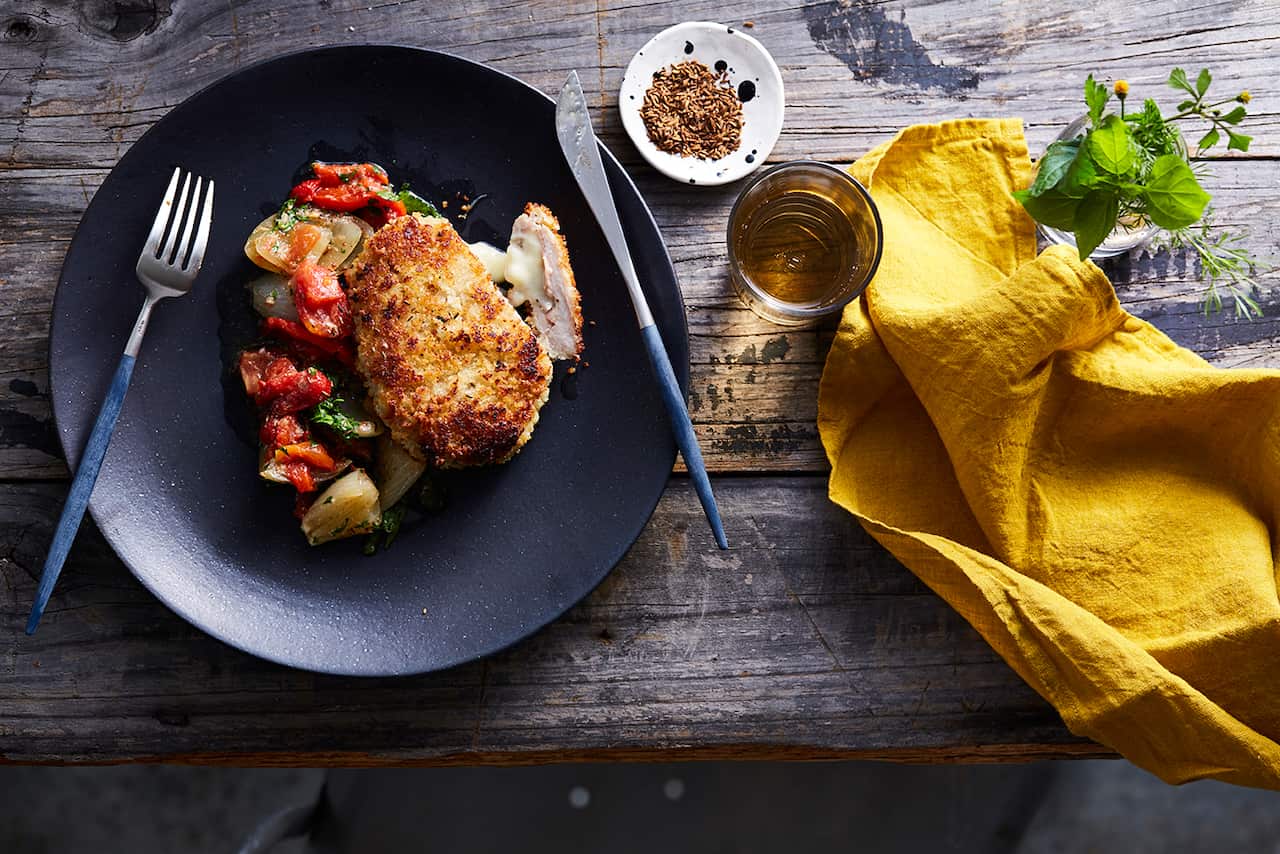 Jamón-wrapped pork schnitzel (san jacobo) with roasted capsicum salsa.
