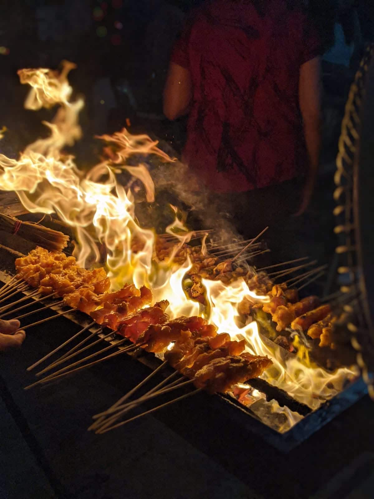 Satay grill in the front yard in Melaka.