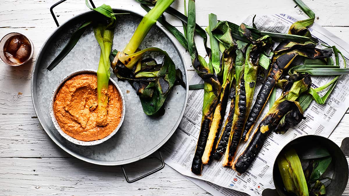 Charred leeks with romesco sauce