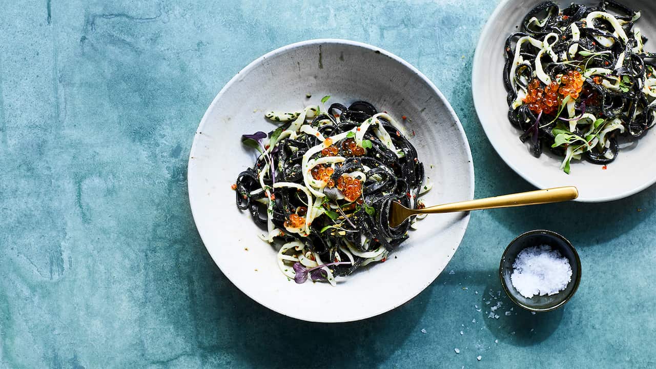 Squid ink tagliolini with calamari, bottarga and salmon roe