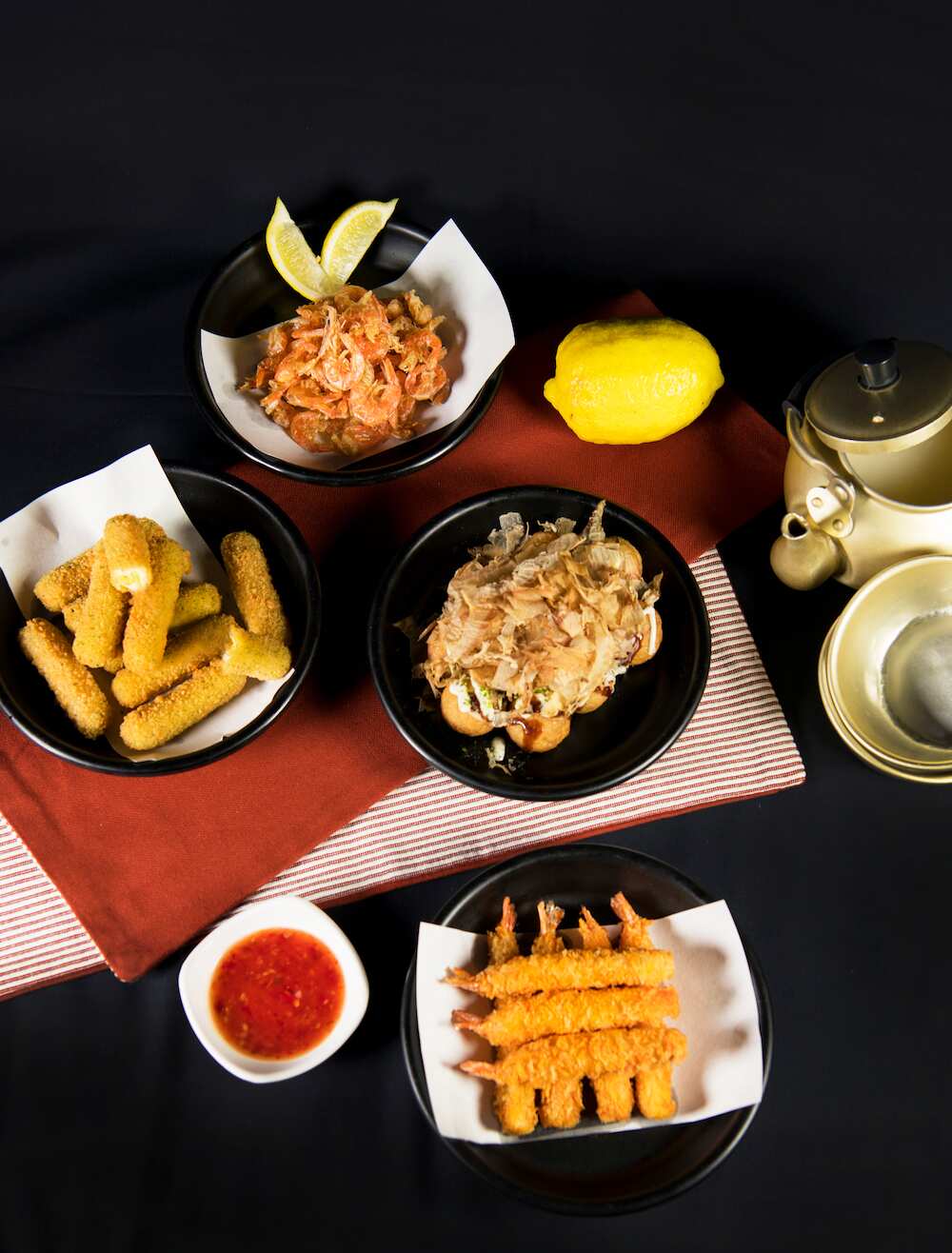 Joomak's booze-friendly snacks and dishes include school prawn, cheese_sticks, takoyaki and deep-fried prawn.