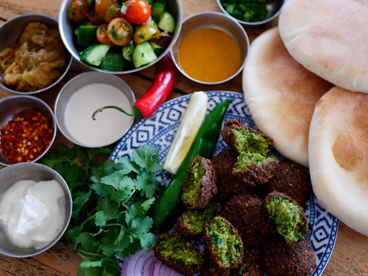 Parsley-bright falafel, which are freshly made from scratch at Shuk Falafel.