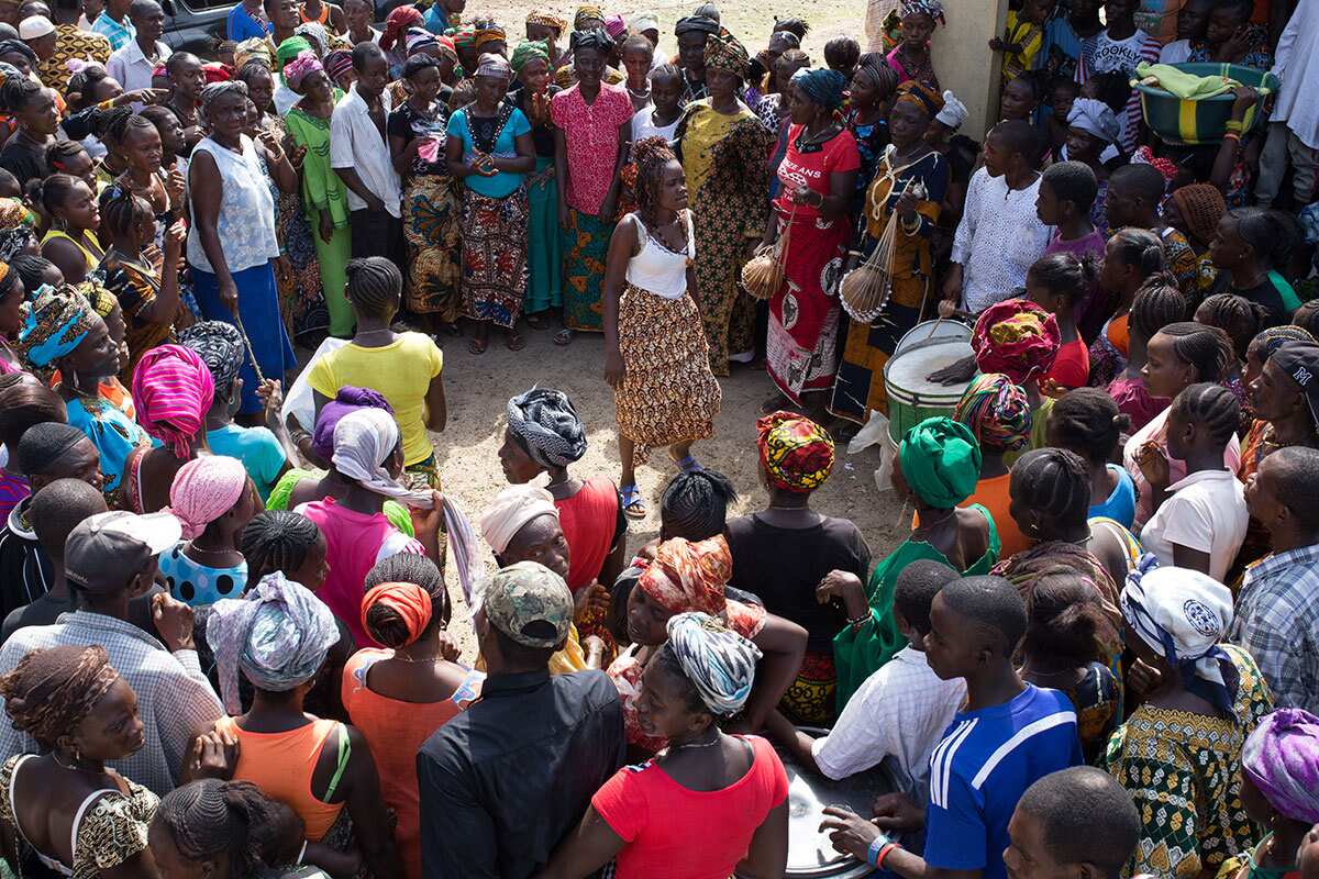 Young women rocking a traditional Bundo Society dance to welcome Karma Cola  to Boma