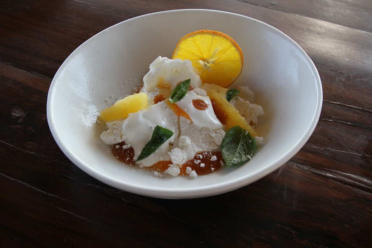 Smashed pavlova with orange curd