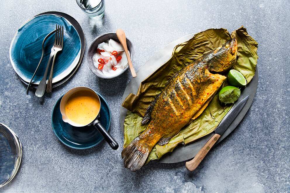 Spiced barramundi in banana leaf with pickled radish
