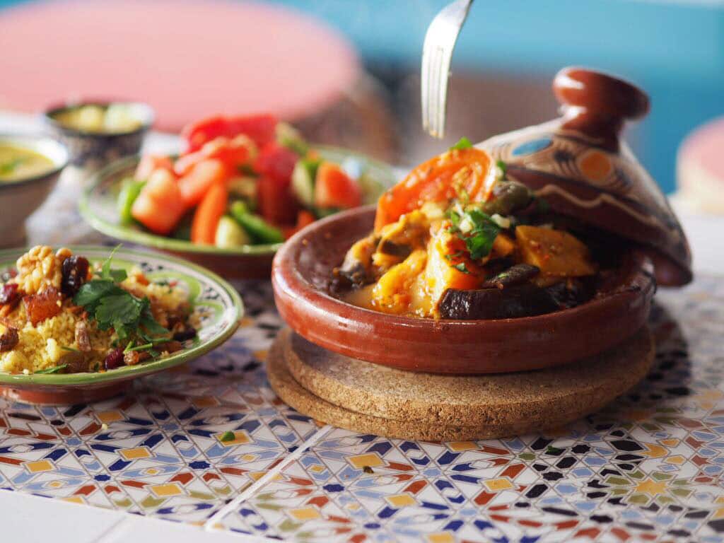 An on-site taginerie dishes out slow-cooked tagines alongside zalouk, an eggplant and tomato salad. 