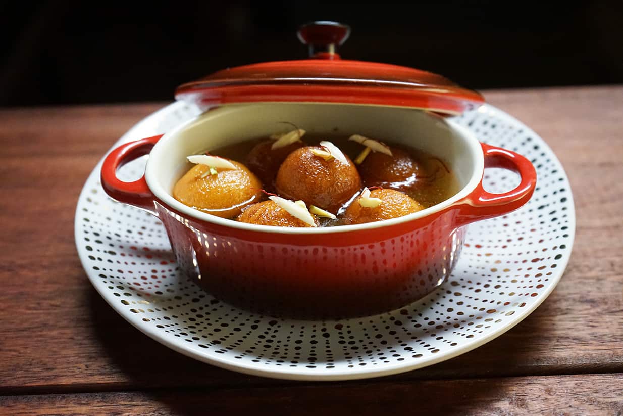 Paneer gulab jamun with rosewater and saffron syrup