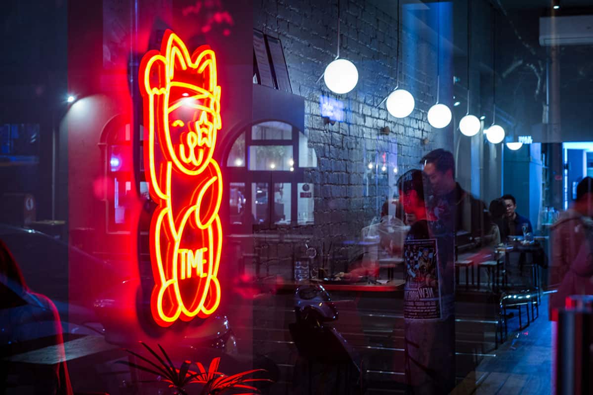 A neon maneki-neko glows at the entrance, signalling fun and good fortune ahead. (Eugene Hyland)