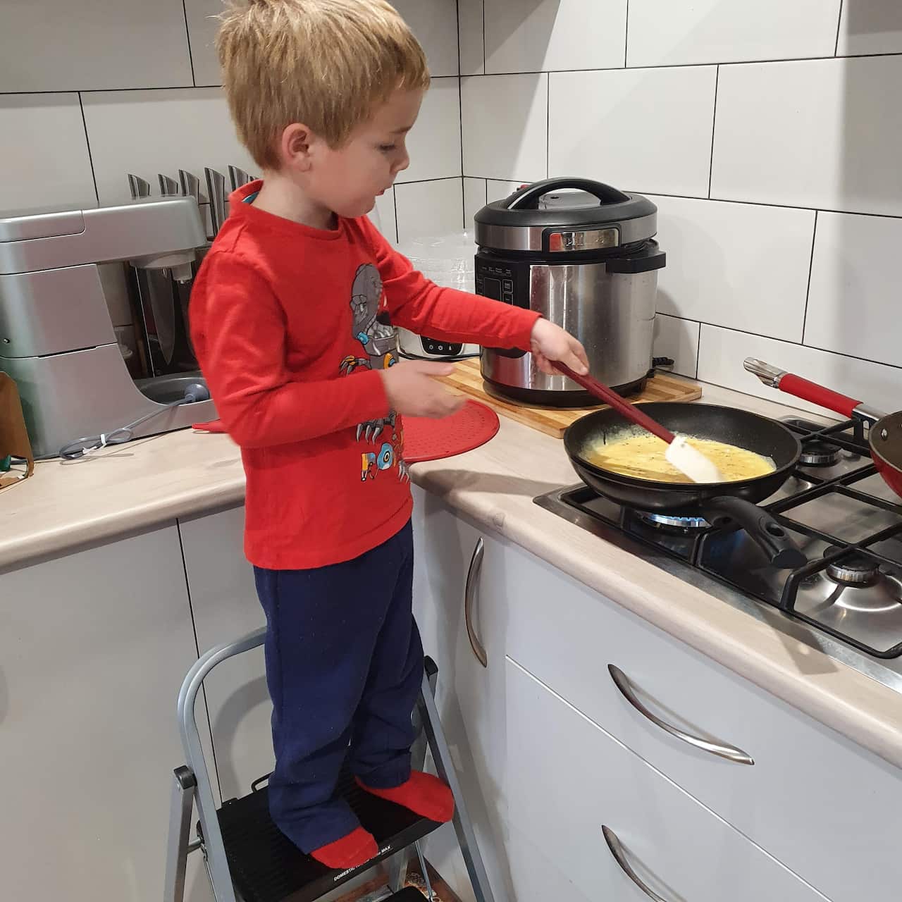 Stanhope's grandson Tom, making scrambled eggs.