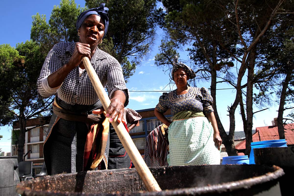 women prepare large quantities of traditional beer (umqombothi) in Bloemfontein, South Africa