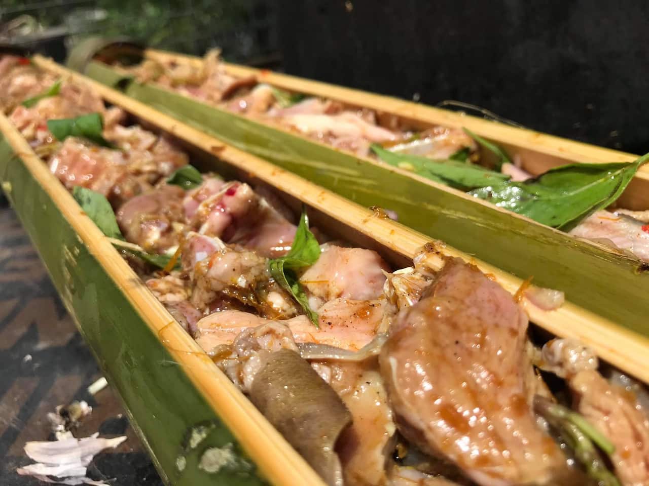 Tukir naan bibi is a traditional Timorese dish featuring lamb that’s cooked in a green bamboo trunk, served with mashed cassava. 